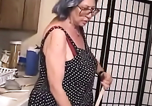 Gray-haired grandmother is severely making out old